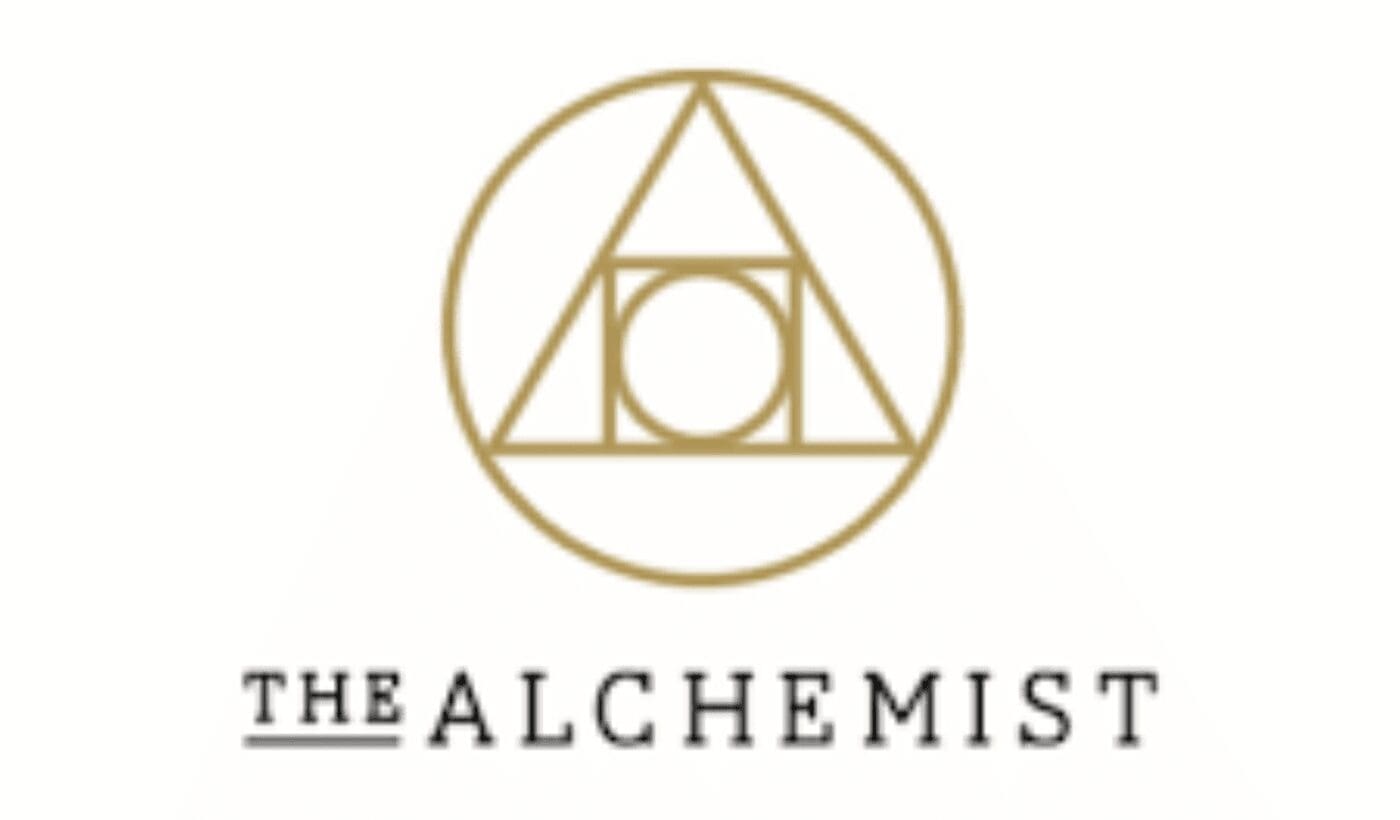 The Alchemist logo with gold geometric symbol
